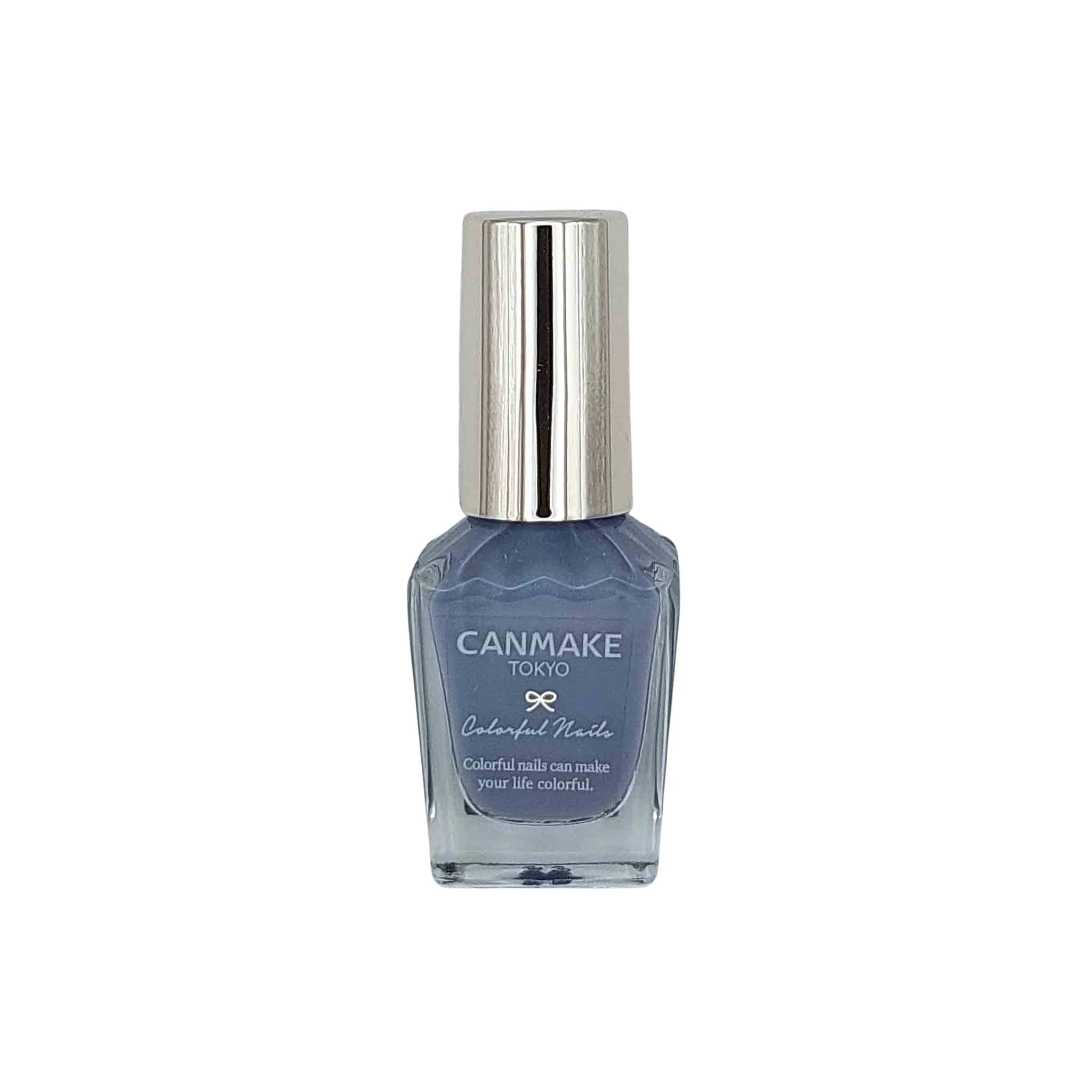 Blue-tinted glass Canmake nail polish bottle with a tall silver cap, wavy edges, and CANMAKE TOKYO Colorful Nails label.