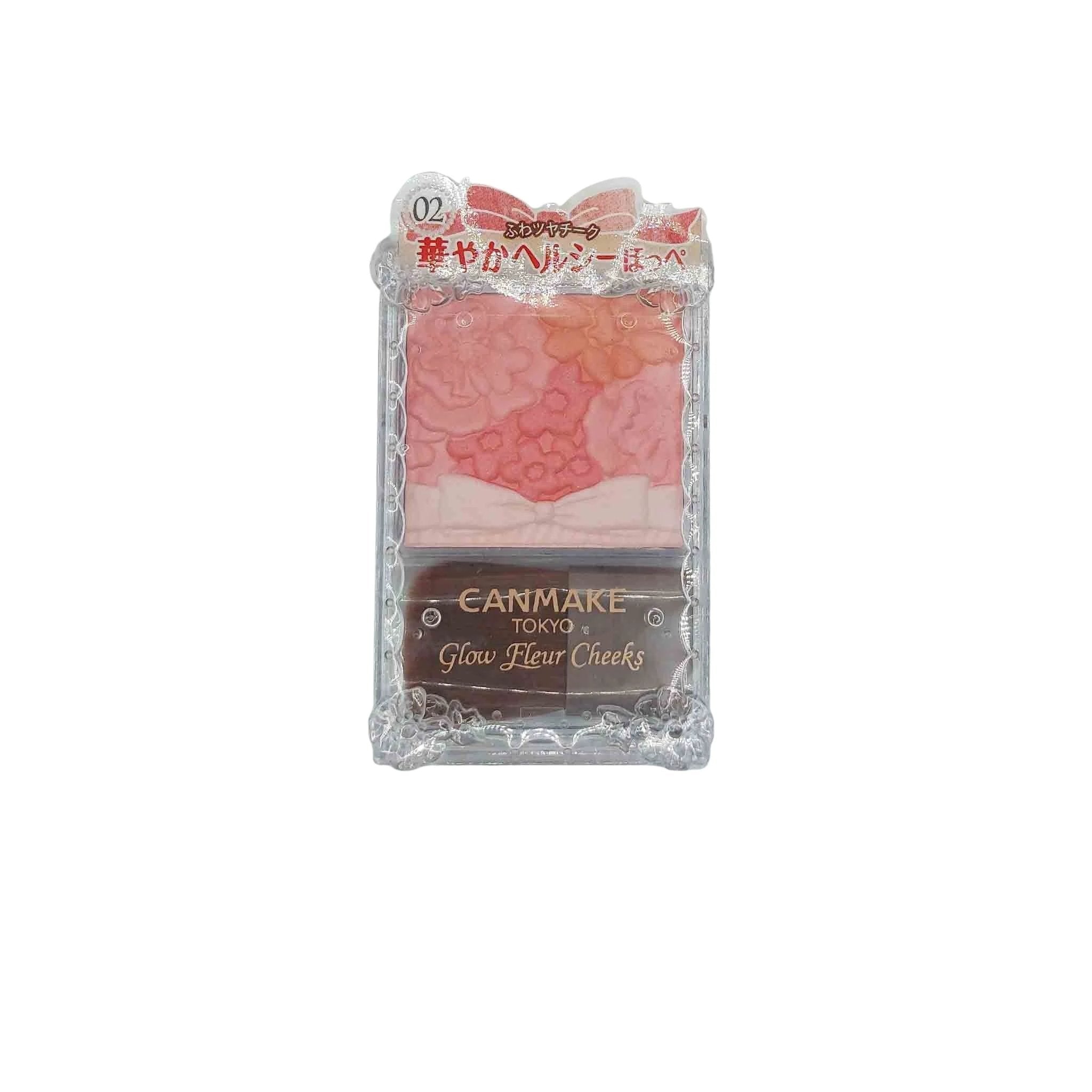 Clear plastic blush compact with pink floral marbled powder, lace border, and gold Canmake Glow Fleur Cheeks label.