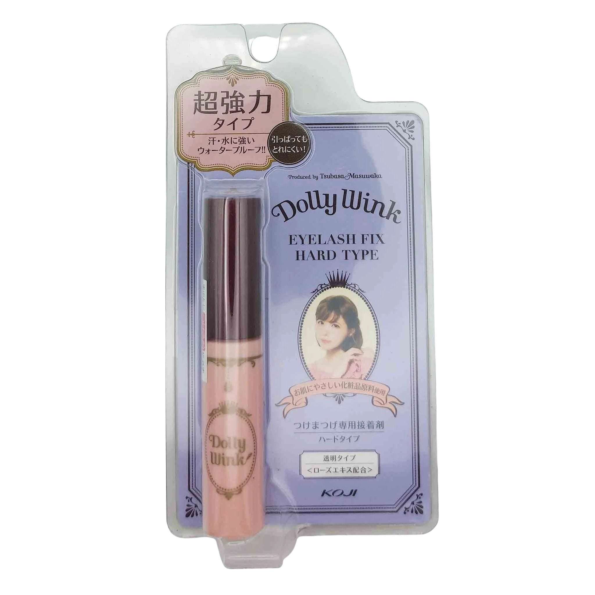 Clear blister pack with pink Dolly Wink eyelash fix adhesive tube and dark cap, mounted on lavender card with ornate frame and portrait.