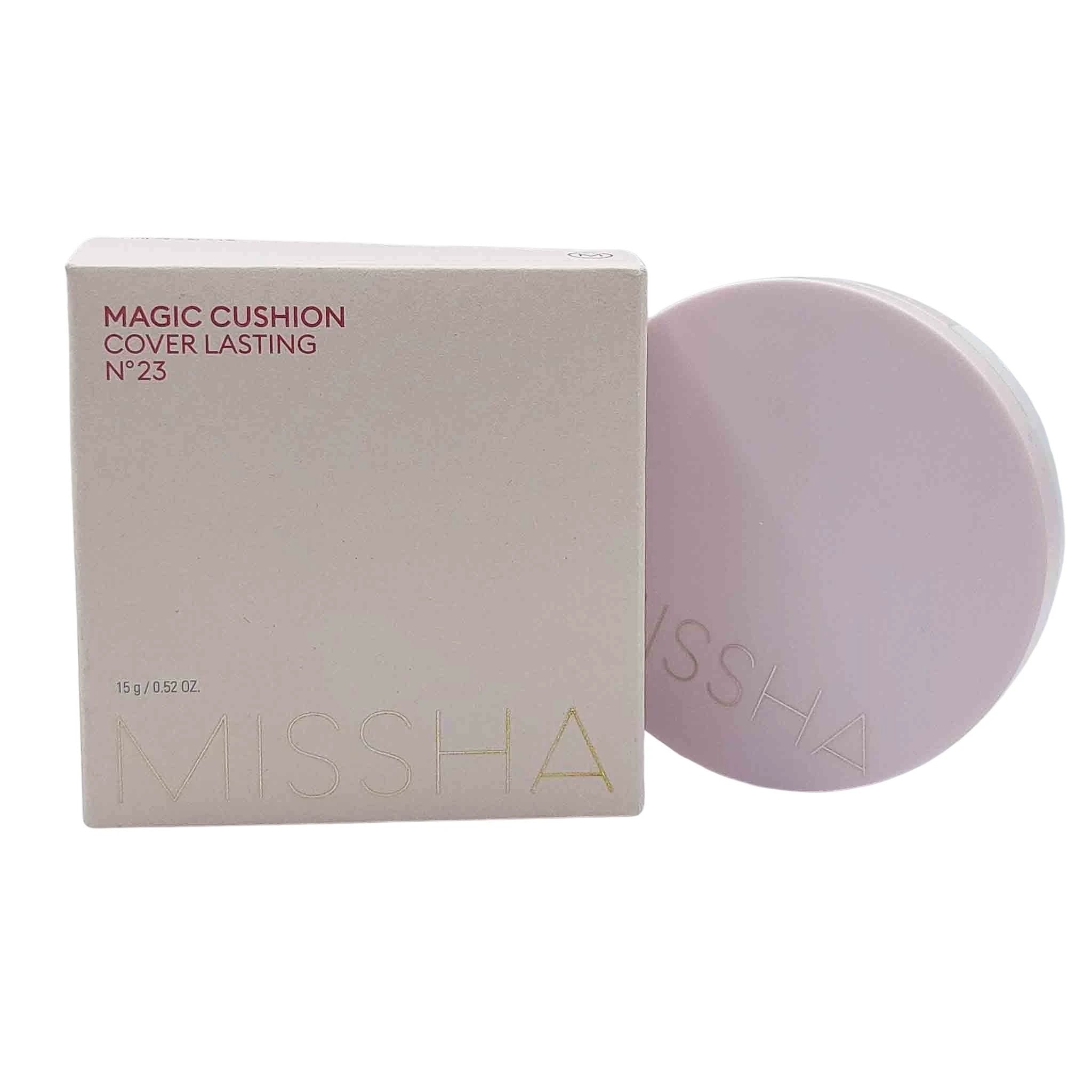 Light pink box reading MAGIC CUSHION COVER LASTING N°23 beside a pale lavender cushion puff with MISSHA embossed.