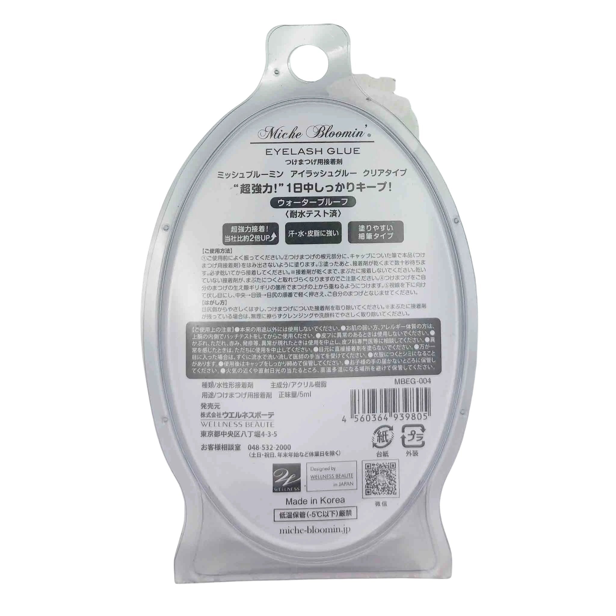 Translucent teardrop-shaped eyelash glue packaging with a hanging hole; back label shows Miche Bloomin' Eyelash Glue and Japanese text.