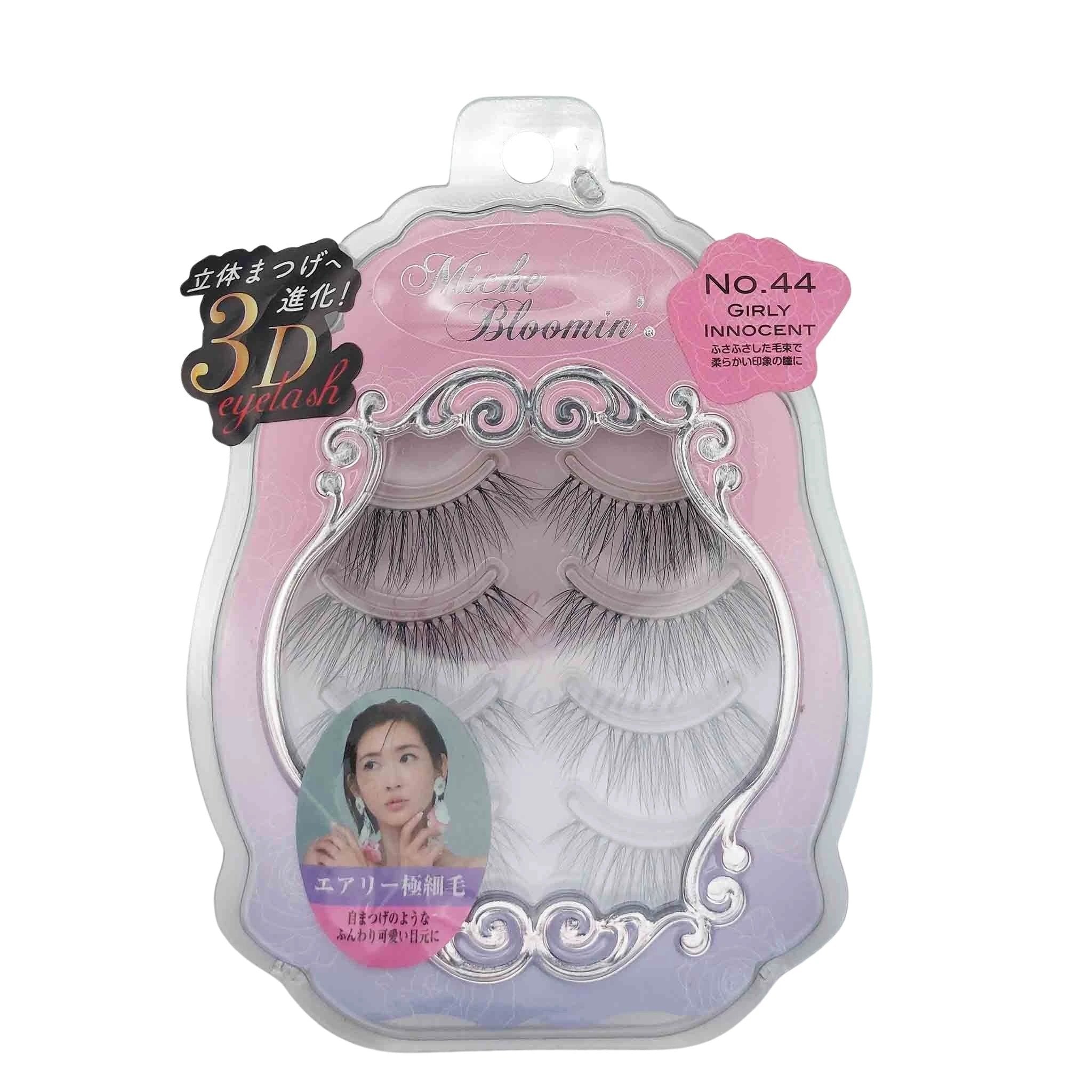 Pastel pink-to-purple packaging with ornate silver scrollwork frame, four trays of false lashes, No.44 Girly Innocent.