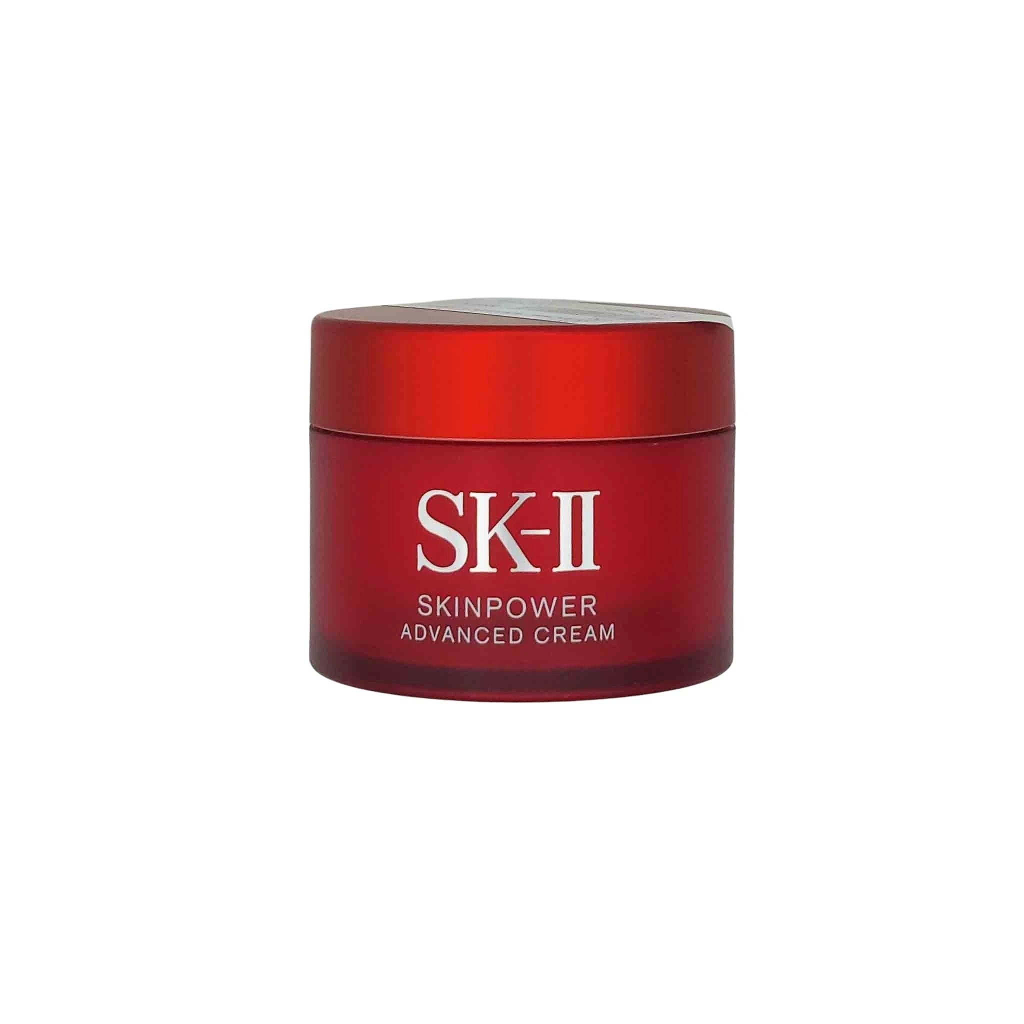 Red frosted jar of SK-II Skinpower Advanced Cream (15g) with white logo and silver lid.
