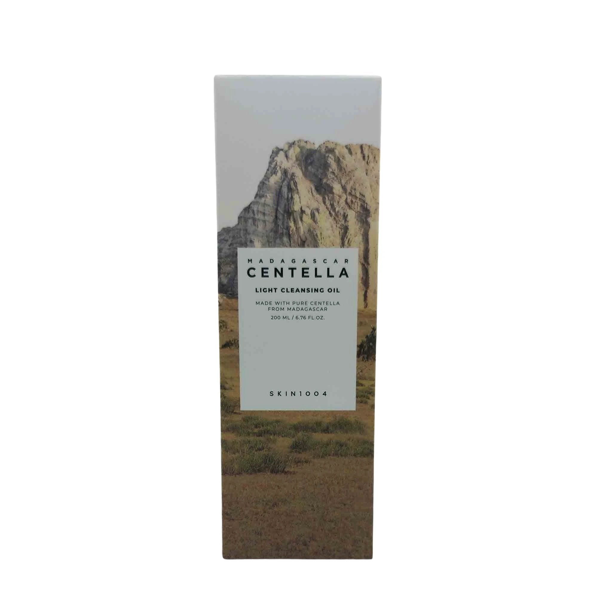 Tall box with a mountain landscape and a light gray label reading Madagascar Centella Light Cleansing Oil, SKIN1004.