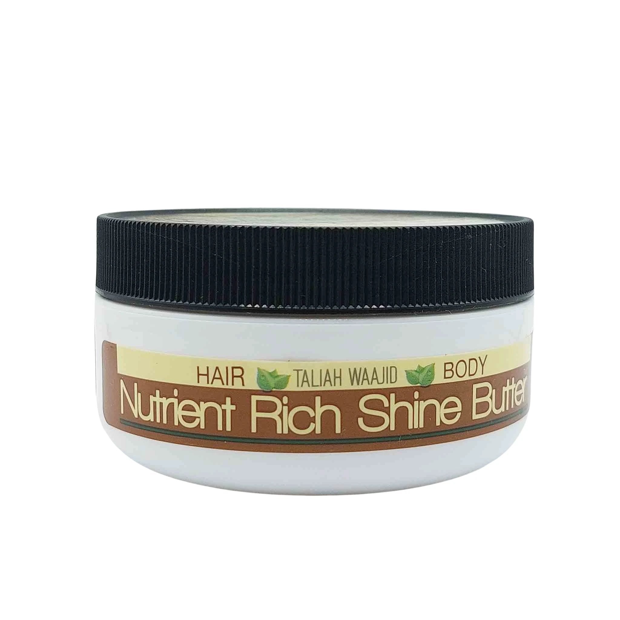 White jar with a black ribbed lid; brown and beige label reads Nutrient Rich Shine Butter, Hair Body, by Taliah Waajid.